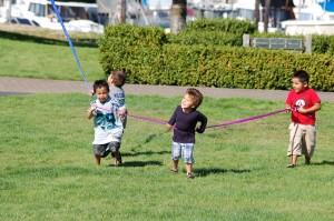 Lummi kids grabbing the kite's tail