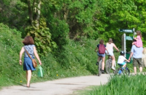 caption of left upper corner of L.R.: Anna, Lucas on bike, Anna on Andy's shoulders